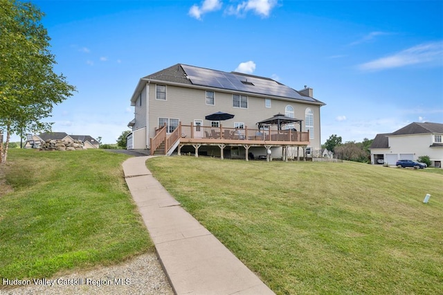 10 Sutton Ln, Goshen, NY 10924 - back of property featuring a wooden deck, a gazebo, a lawn, and a chimney