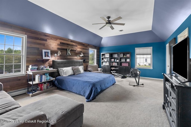 10 Sutton Ln, Goshen, NY 10924 - carpeted bedroom with lofted ceiling, baseboard heating, wooden walls, and a ceiling fan