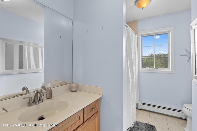 10 Sutton Ln, Goshen, NY 10924 - bathroom with a baseboard heating unit, vanity, and tile patterned floors