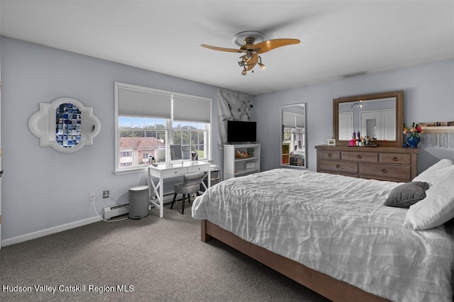 10 Sutton Ln, Goshen, NY 10924 - bedroom featuring carpet, a baseboard heating unit, and ceiling fan