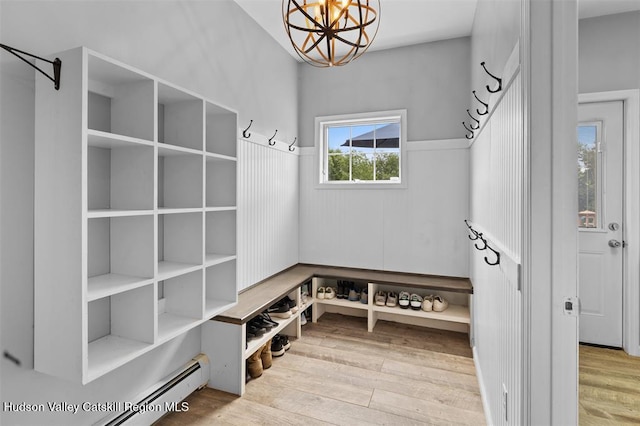 10 Sutton Ln, Goshen, NY 10924 - mudroom featuring wood finished floors, a chandelier, and baseboard heating