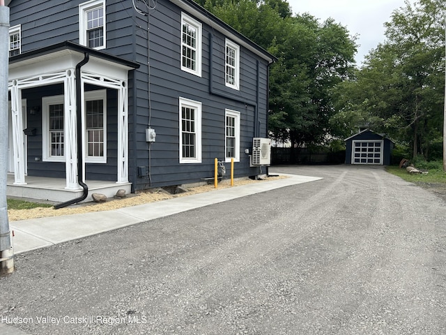 42 Ulster Ave, Saugerties, NY 12477 - view of home's exterior featuring a storage shed and a garage