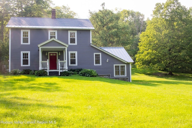 477 Fog Hill Rd, Austerlitz, NY 12017 - colonial-style house featuring a front lawn and a chimney