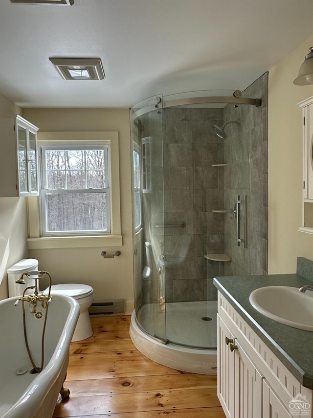 477 Fog Hill Rd, Austerlitz, NY 12017 - full bathroom featuring hardwood / wood-style floors, a freestanding tub, a stall shower, a baseboard heating unit, and vanity