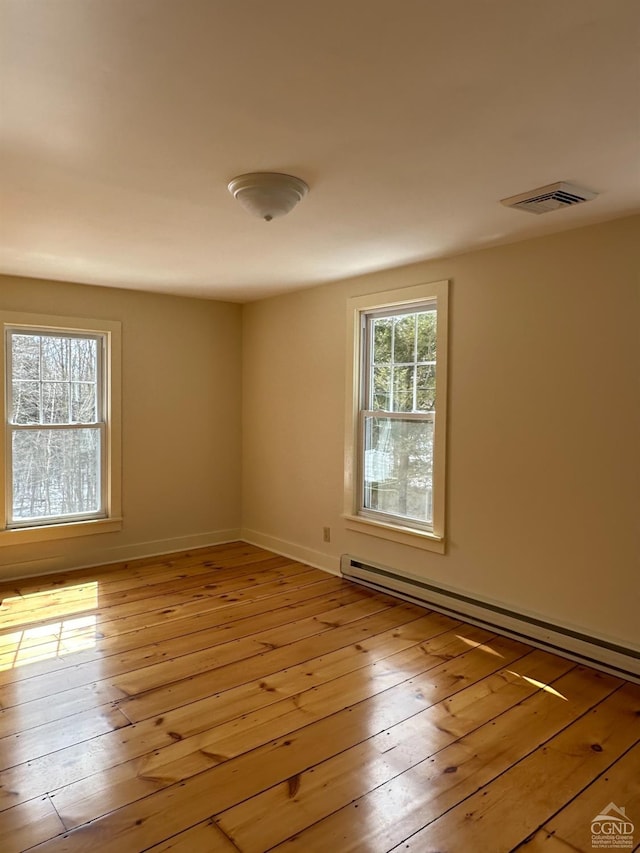 477 Fog Hill Rd, Austerlitz, NY 12017 - spare room with a baseboard radiator and light wood-type flooring