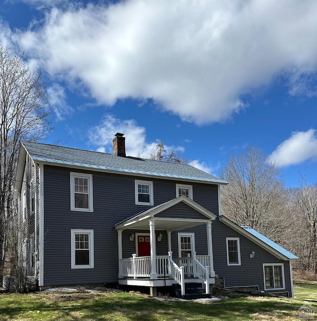 477 Fog Hill Rd, Austerlitz, NY 12017 - view of front of property with a porch, a chimney, and a front yard