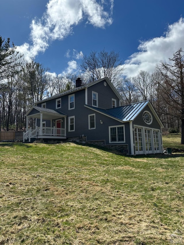 477 Fog Hill Rd, Austerlitz, NY 12017 - rear view of house with french doors, a chimney, a lawn, a standing seam roof, and a wooden deck