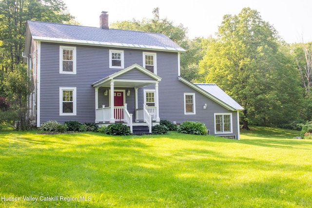 477 Fog Hill Rd, Austerlitz, NY 12017 - colonial home featuring a chimney, covered porch, and a front yard