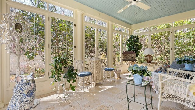sunroom with a ceiling fan and plenty of natural light