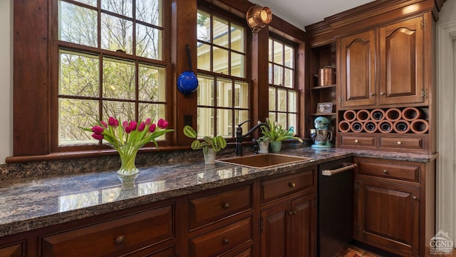 bar area featuring a sink and dishwasher