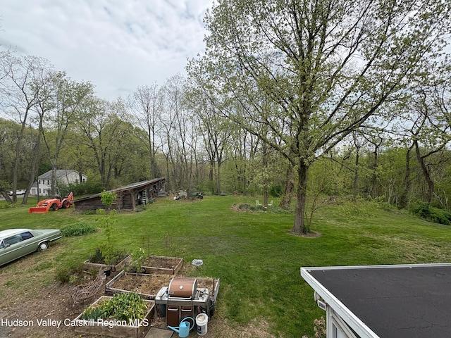 3766 US Route 9, Hudson, NY 12534 - view of green lawn featuring a garden and a wooded view