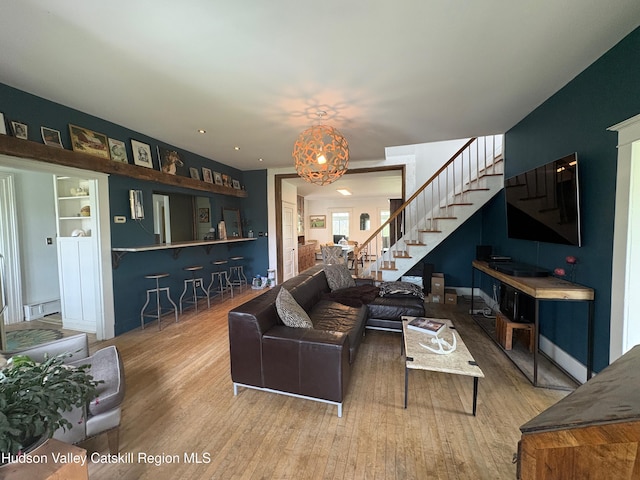 3766 US Route 9, Hudson, NY 12534 - living area with stairway, baseboard heating, and wood finished floors
