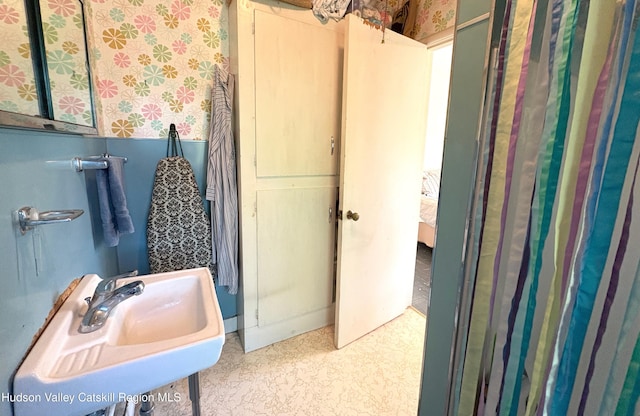 3766 US Route 9, Hudson, NY 12534 - bathroom with wallpapered walls, a sink, tile patterned floors, and wainscoting