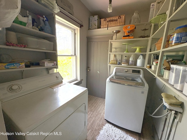 3766 US Route 9, Hudson, NY 12534 - clothes washing area featuring washer and clothes dryer and light wood-type flooring