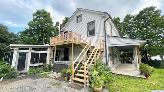 3766 US Route 9, Hudson, NY 12534 - rear view of house featuring a hot tub, a wooden deck, a sunroom, and stairs