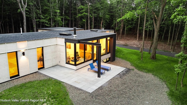 8 Accurso Rd, Saugerties, NY 12477 - back of house with a forest view and roof with shingles