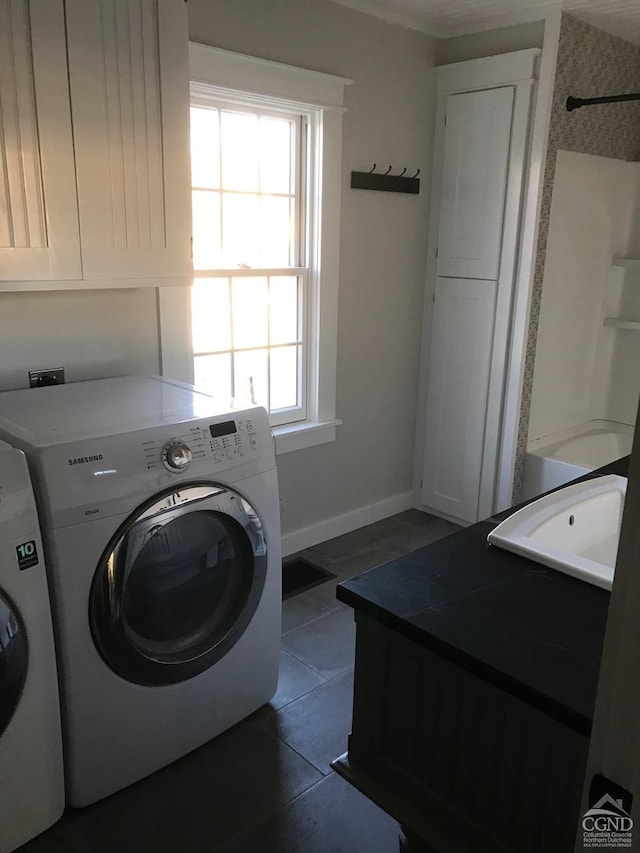 11293 Rte 32, Greenville, NY 12083 - laundry room with washer and clothes dryer, cabinet space, and dark tile patterned flooring