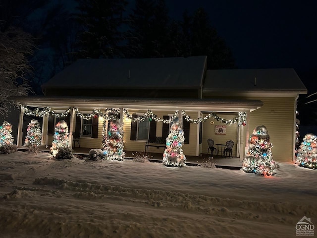 11293 Rte 32, Greenville, NY 12083 - back of house at twilight featuring covered porch