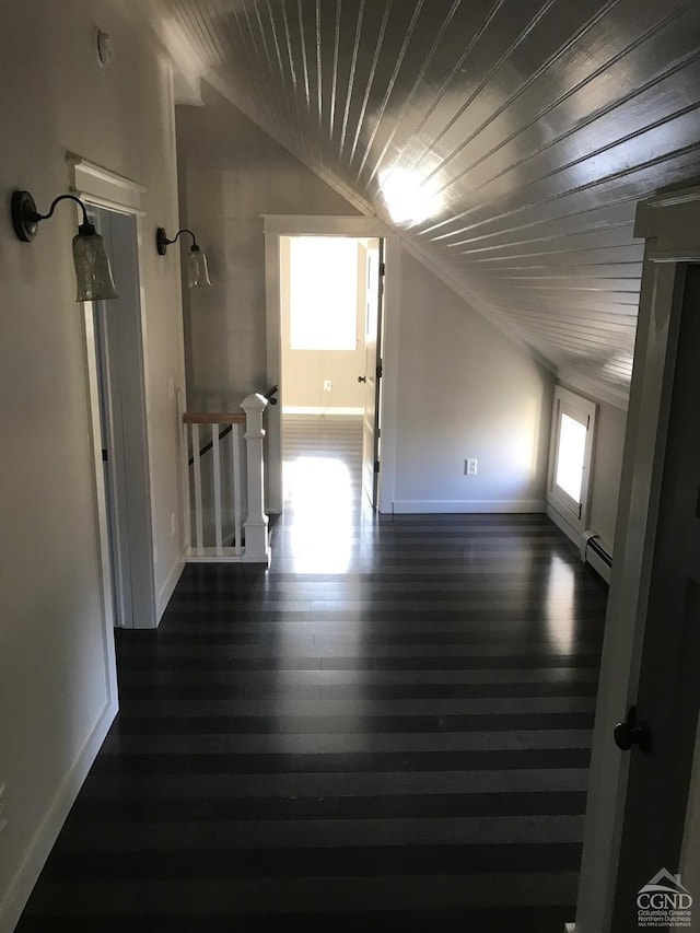 11293 Rte 32, Greenville, NY 12083 - unfurnished room featuring baseboard heating, wood ceiling, lofted ceiling, and dark wood-type flooring