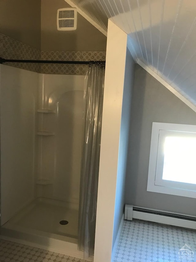 11293 Rte 32, Greenville, NY 12083 - bathroom with a baseboard heating unit, a stall shower, lofted ceiling, and tile patterned floors