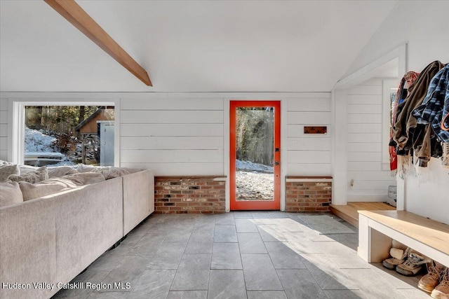 interior space with lofted ceiling with beams