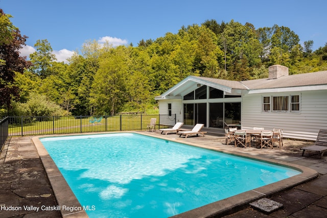 view of swimming pool featuring a patio area