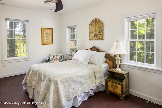 bedroom featuring ceiling fan and dark hardwood / wood-style floors