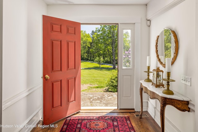 foyer with dark hardwood / wood-style floors