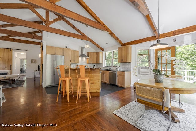 82 Near Rd, Red Hook, NY 12571 - kitchen with appliances with stainless steel finishes, wall chimney range hood, high vaulted ceiling, dark wood finished floors, and backsplash