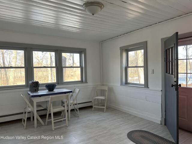 doorway featuring sink and light hardwood / wood-style flooring