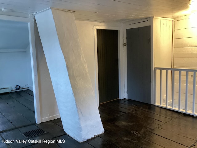 spare room featuring dark wood-type flooring