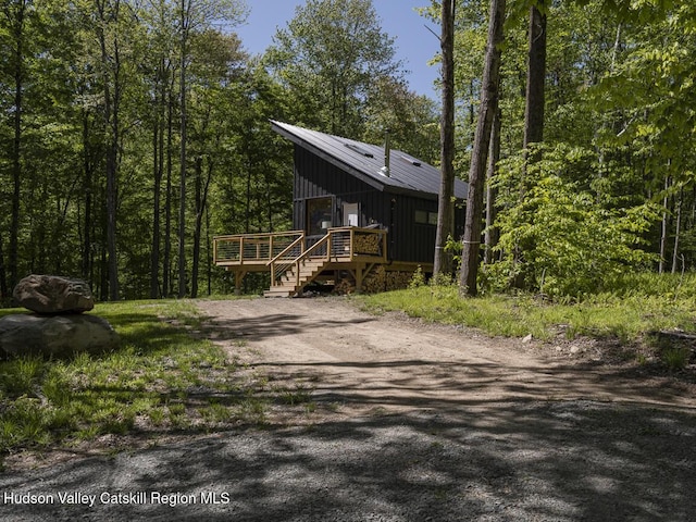 view of front facade featuring board and batten siding and a deck