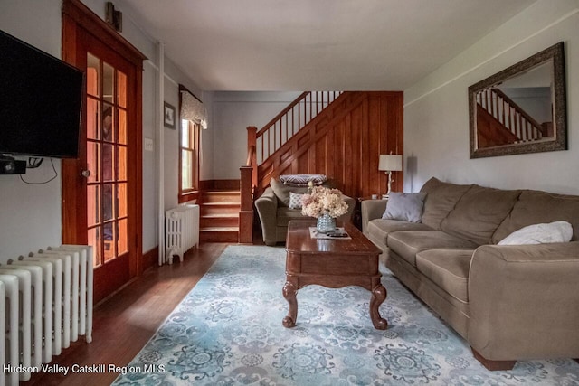 22 Hill St, Napanoch, NY 12458 - living room featuring radiator, stairway, and wood finished floors