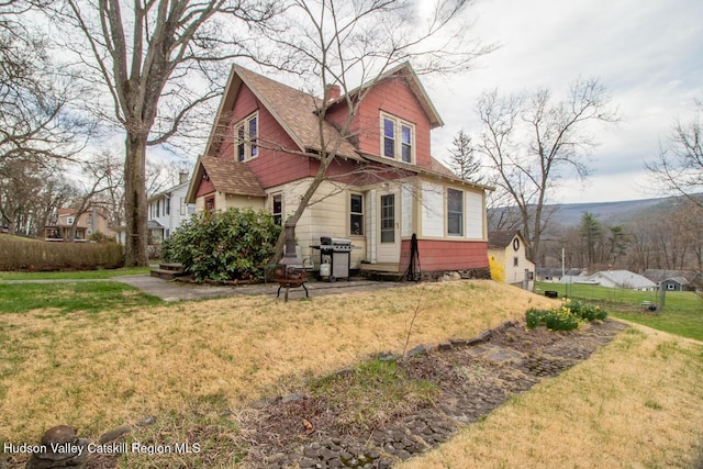 22 Hill St, Napanoch, NY 12458 - back of house with a chimney and a yard