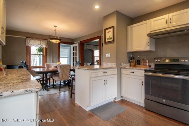 22 Hill St, Napanoch, NY 12458 - kitchen with electric stove, under cabinet range hood, white cabinetry, a peninsula, and dark wood-style floors