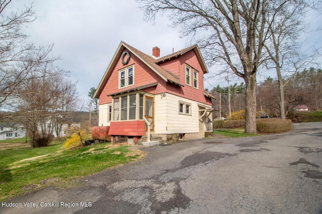 22 Hill St, Napanoch, NY 12458 - view of side of property with a chimney and asphalt driveway