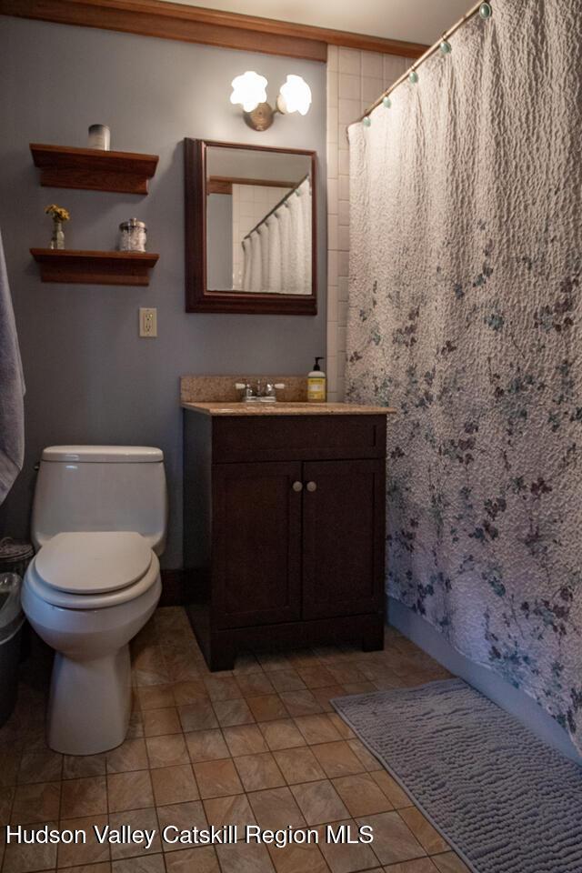22 Hill St, Napanoch, NY 12458 - full bath featuring vanity and a shower with shower curtain