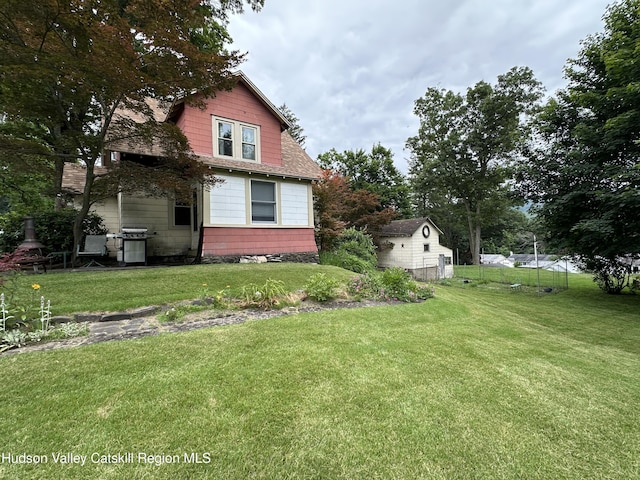 22 Hill St, Napanoch, NY 12458 - view of side of property featuring a lawn and roof with shingles