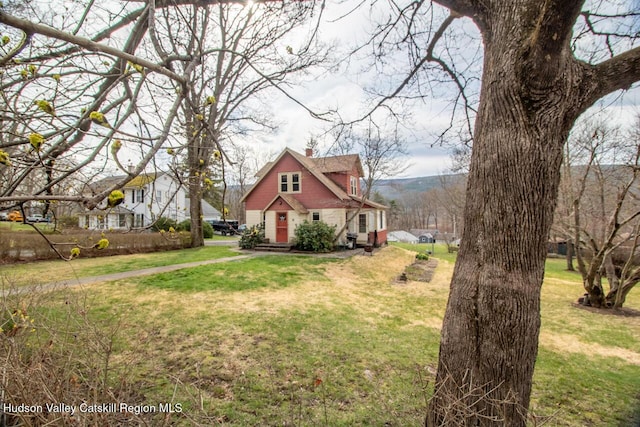 22 Hill St, Napanoch, NY 12458 - view of property exterior featuring a chimney and a lawn
