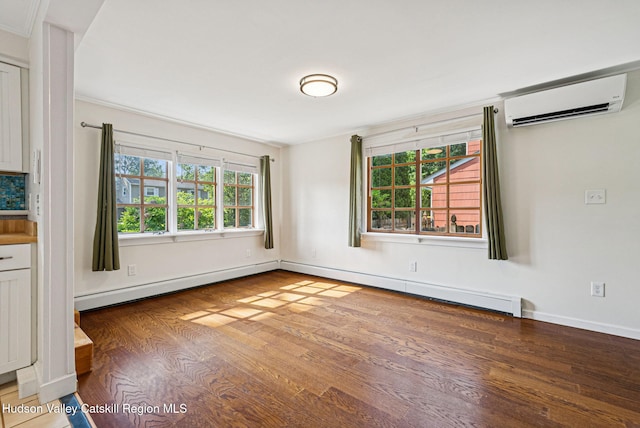 6 Stevens Ct, Saugerties, NY 12477 - spare room with a wall mounted air conditioner, wood finished floors, plenty of natural light, and baseboards
