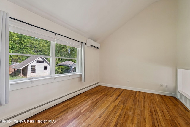 6 Stevens Ct, Saugerties, NY 12477 - empty room with baseboard heating, a wall mounted AC, vaulted ceiling, wood finished floors, and baseboards