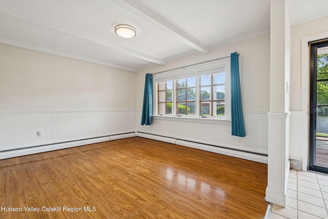 6 Stevens Ct, Saugerties, NY 12477 - unfurnished room with beamed ceiling, healthy amount of natural light, wainscoting, light wood-type flooring, and decorative columns