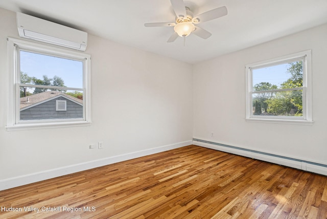 6 Stevens Ct, Saugerties, NY 12477 - empty room with a wall mounted AC, wood finished floors, baseboards, and a baseboard heating unit