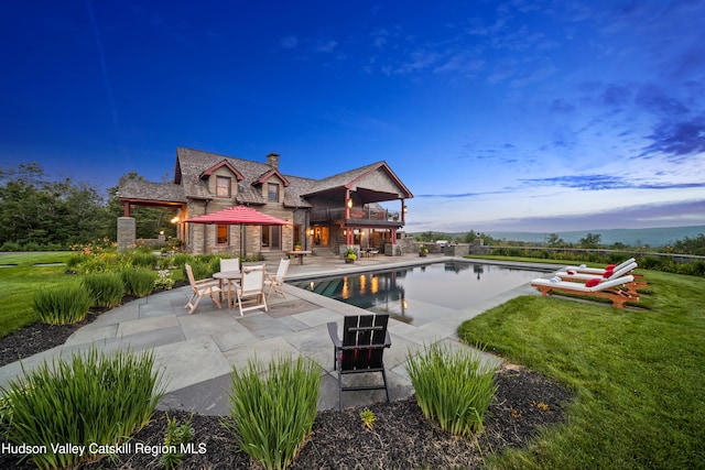 exterior space with a lawn and a patio