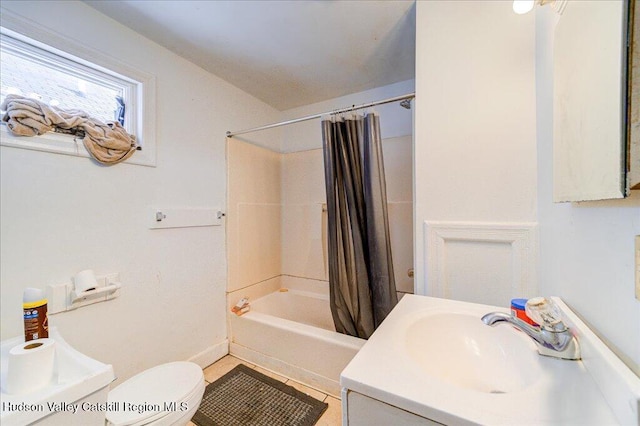 bathroom featuring toilet, tile patterned flooring, shower / tub combo with curtain, and vanity