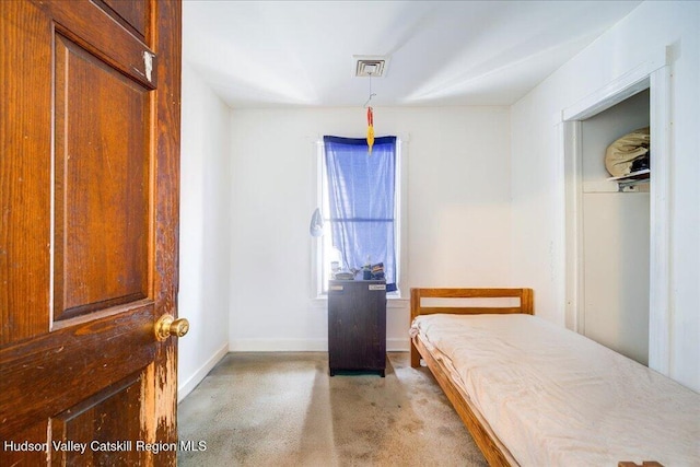 bedroom featuring visible vents and baseboards