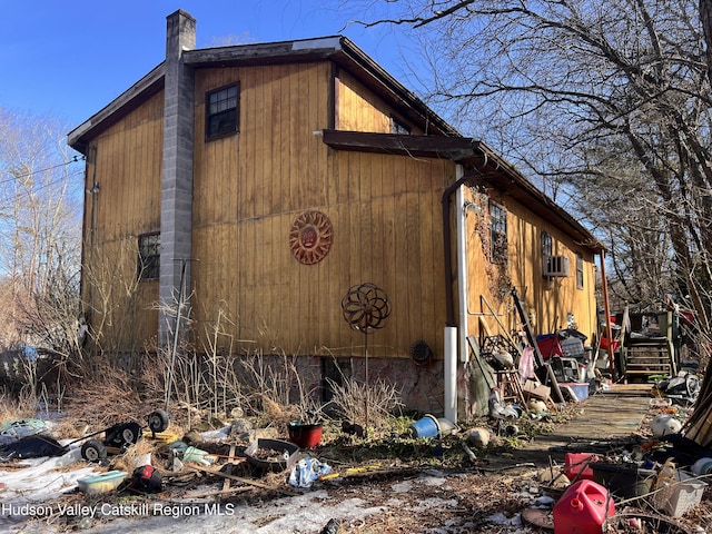 view of side of home with a chimney