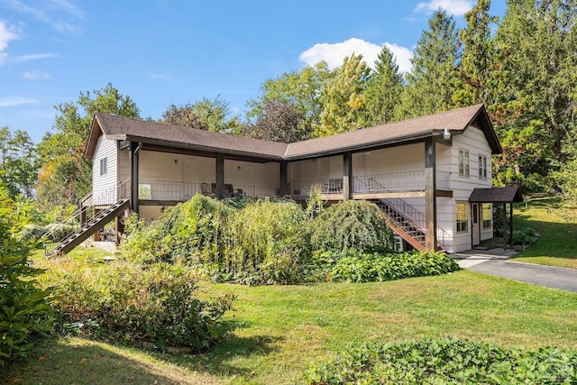 7951 State Route 22, Copake, NY 12516 - view of property exterior with stairs, a lawn, and a shingled roof