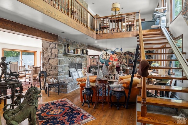 7951 State Route 22, Copake, NY 12516 - living area with wood finished floors, stairway, and a fireplace