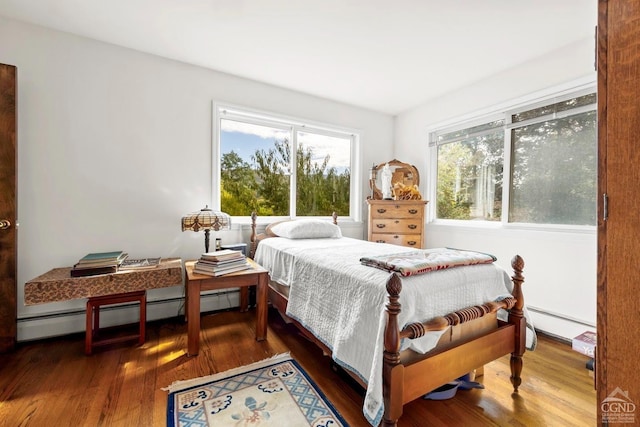 7951 State Route 22, Copake, NY 12516 - bedroom with a baseboard heating unit and wood finished floors